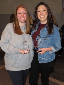 GPD Staff Members Cassidy Reinhard and Kara Moss pose with their IPRA Conference Awards