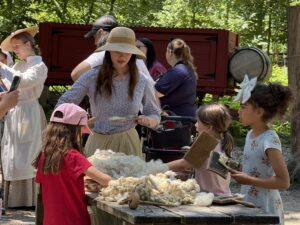 Kids enjoying activities at Pioneer Day at The Grove.